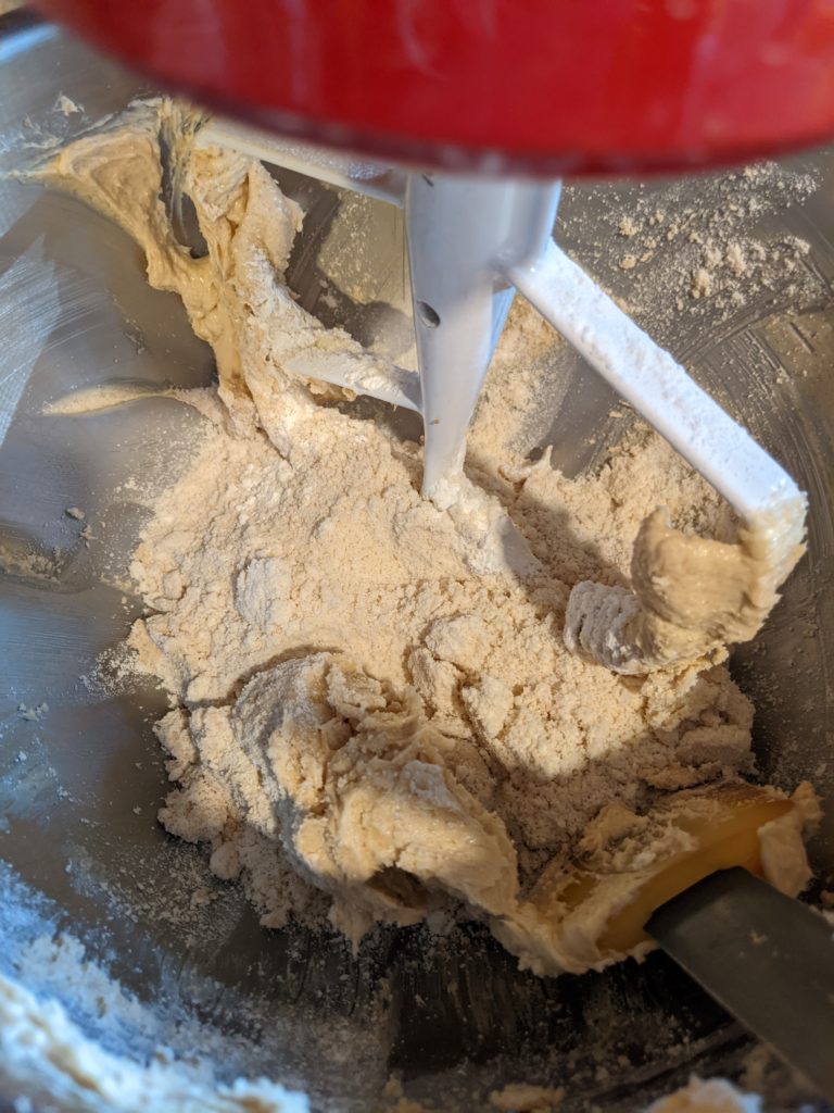 Mixing the flour into the creamed sugar and butter